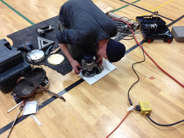 wood-floor-volleyball-sleeve-installation.jpg